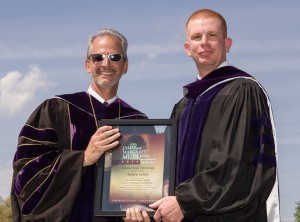 President Troy Paino, left, honors Andrew LeFors with the James and Margaret Mudd Teacher Recognition Scholarship during the Spring 2014 Commencement Ceremony.