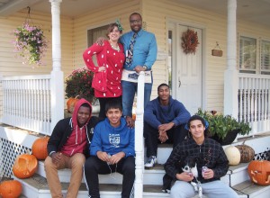 Rachel and Jeremy Mapp (standing) prepare to celebrate Halloween with some of the residents of Joe’s Place. The Mapps serve as house parents for the program that provides homeless teenage boys a supportive home environment.