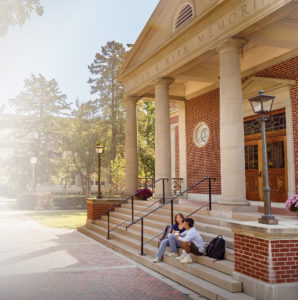 Students sit on the steps of Kirk Memorial