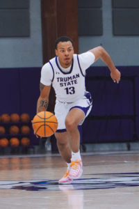 Julian dribbling basketball